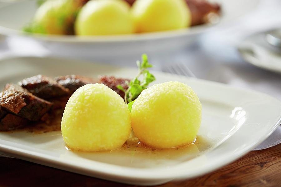 Potato Dumplings As A Side Dish Served With Roast Goose Photograph by Herbert Lehmann