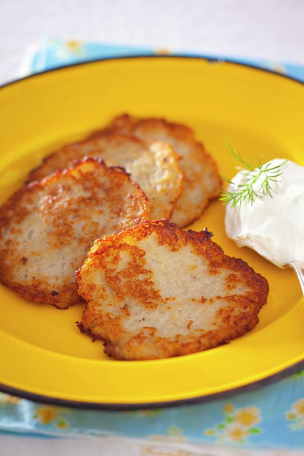 Potato Fritters With A Blob Of Sour Cream Photograph by Studio Lipov ...