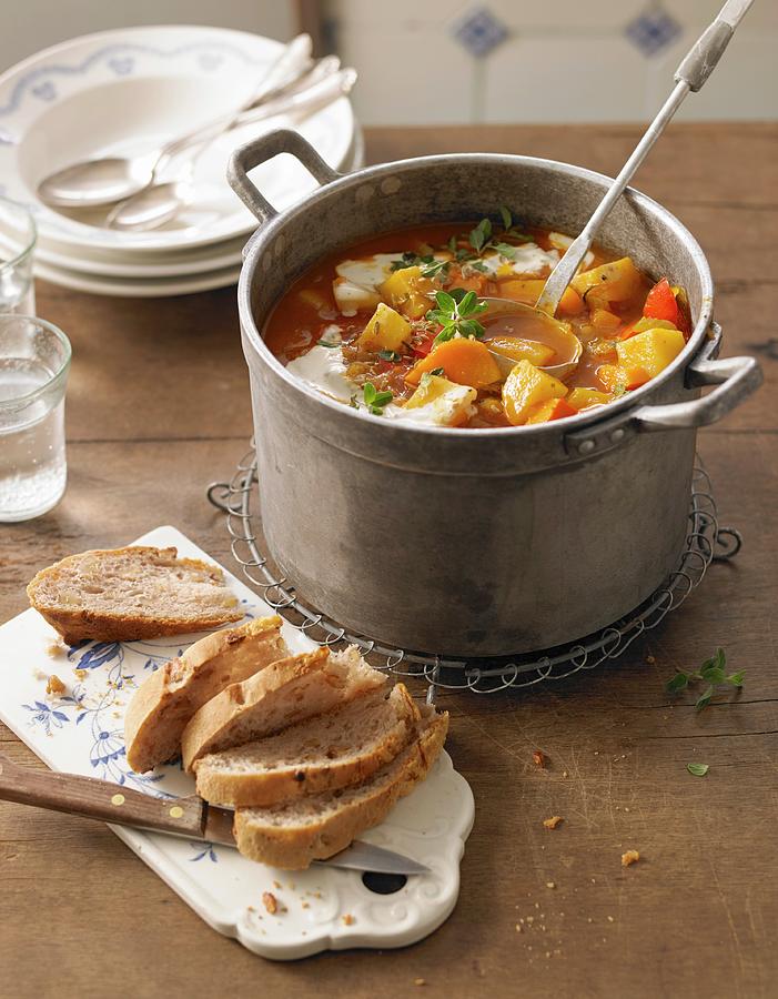 Potato Goulash With Pumpkin And Walnut Bread Photograph by Jan-peter Westermann