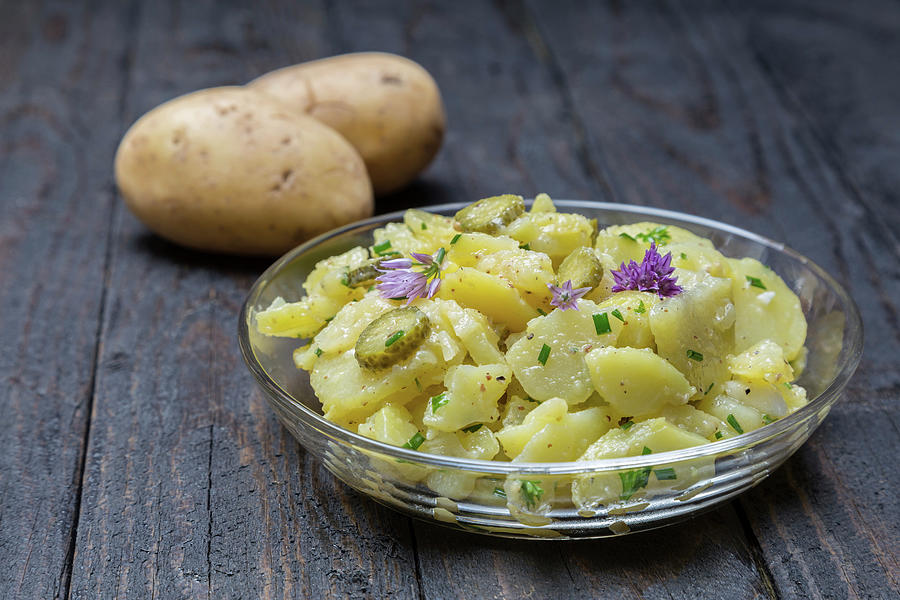 Potato Salad With Herbs And Chive Flowers Photograph by Nils Melzer