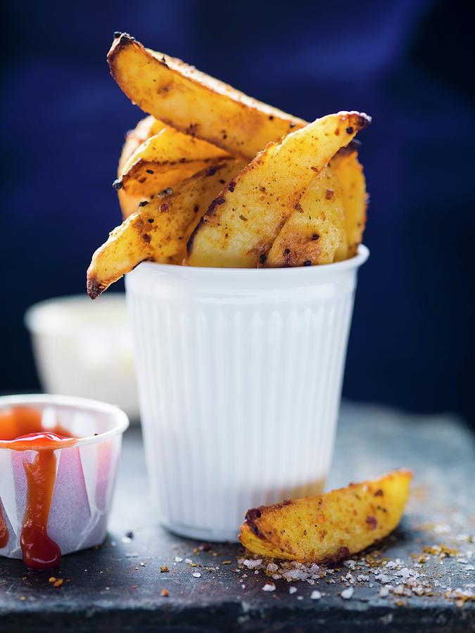 Potato Wedges In A Cup And Ketchup Photograph by Eising Studio