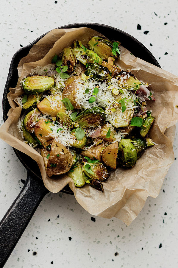 Potatoes And Brussels Sprouts In Parchment Paper Photograph by Monika Rosa