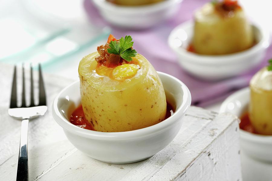 Potatoes Filled With Egg And Ham In A Tomato Sauce Photograph by Gastromedia