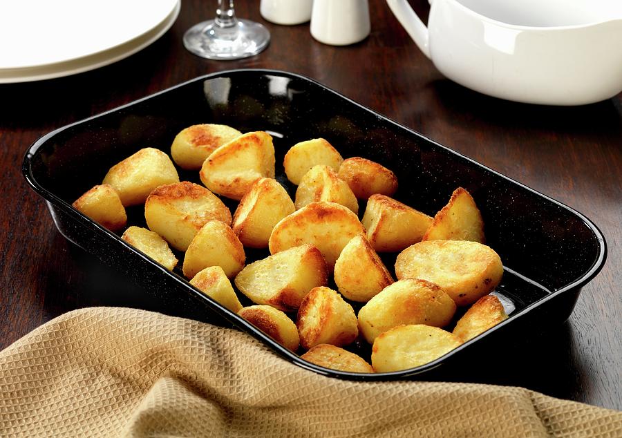 Potatoes Roasted In Goose Fat Photograph by Robert Morris