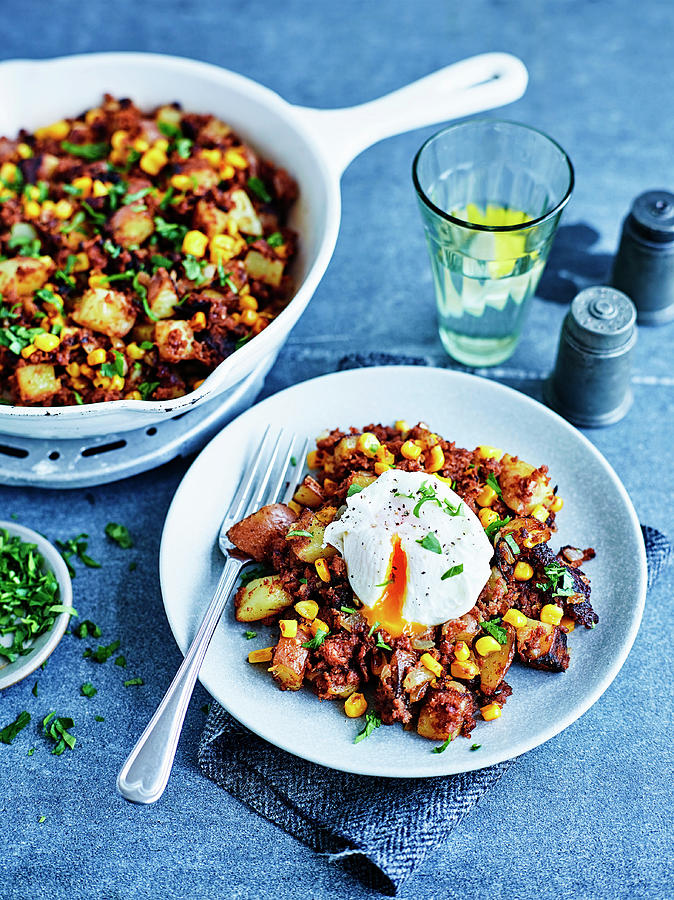 Potatoes With Corned Beef Hash And Poached Eg Photograph by Charlie Richards
