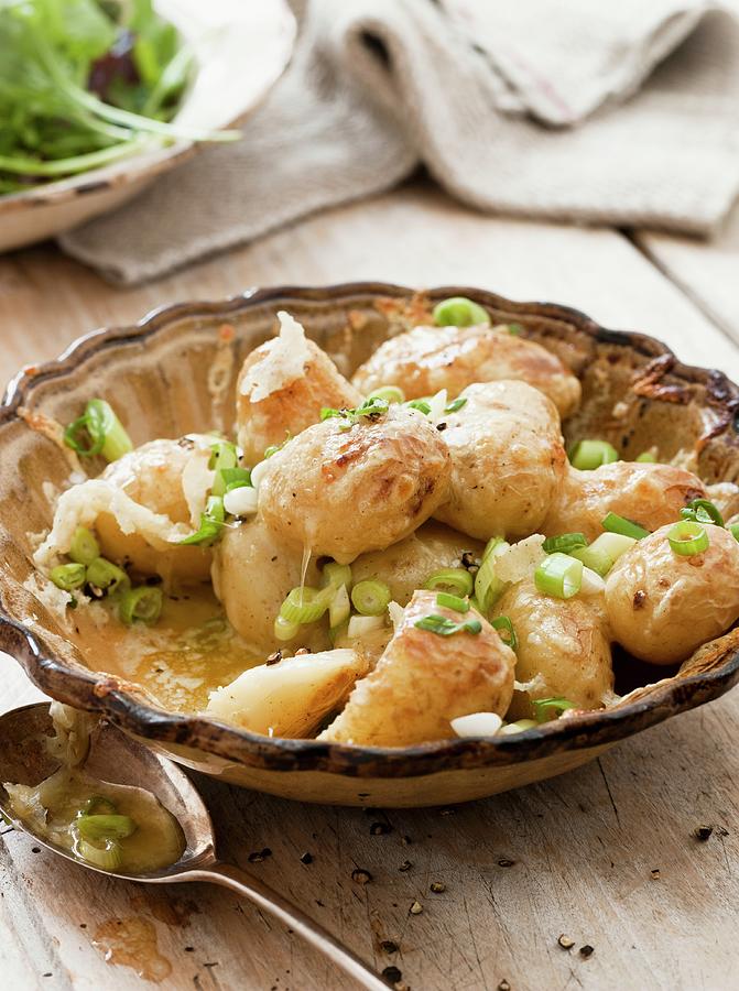 Potatoes With Fontina Cheese And Spring Onions Photograph by Lingwood, William