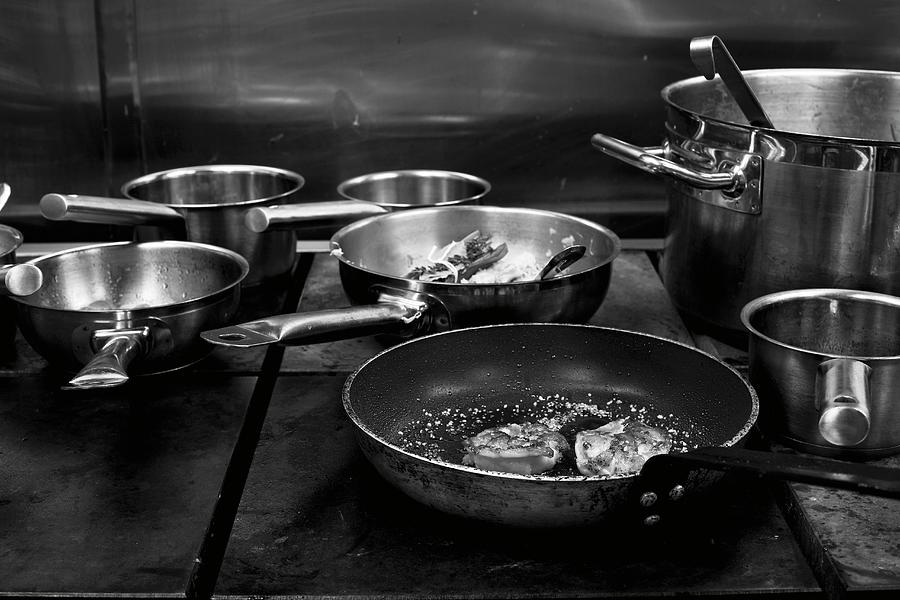 Pots And Pans On A Stove Photograph by Mans Jensen