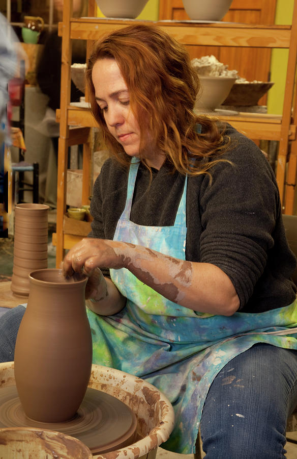 Potter molds mud into pots Painting by Carol Highsmith