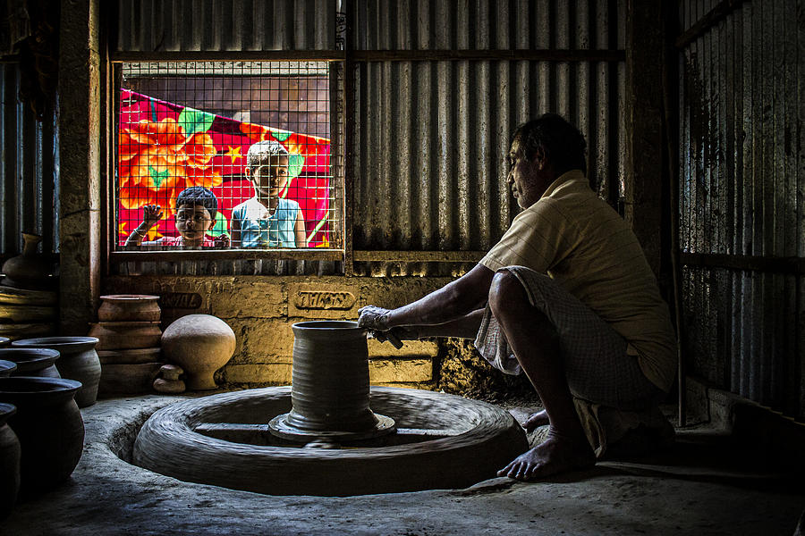 Street Photograph - Potters Wheel by Dipankar Paul