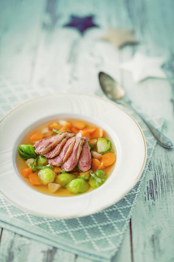 Poultry Consomme With Carrots And Brussels Sprouts christmas Photograph by Jan Wischnewski