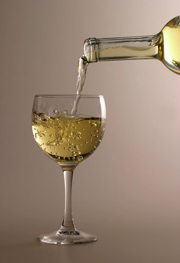 Pouring White Wine Photograph by Donald gruener