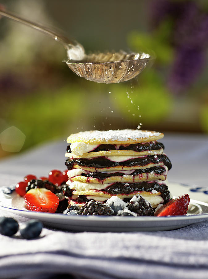 Powdered Sugar Dusted On A Pancake Stack With Berries And Cream Photograph by Pepe Nilsson