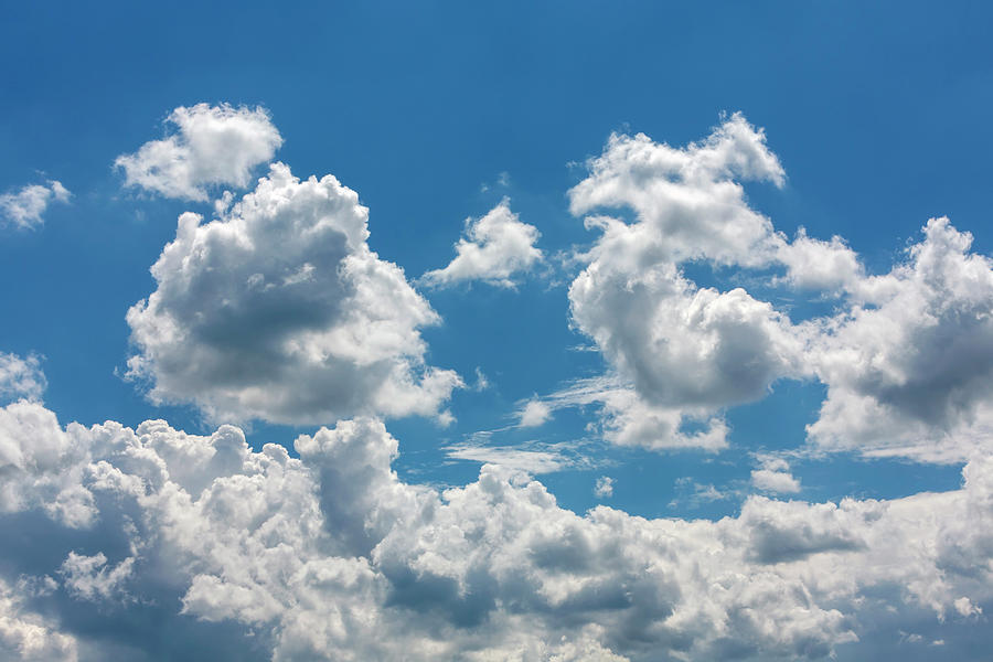 Powerful White Cumulus Clouds In The Blue Sky Photograph by Wolfgang Gasser