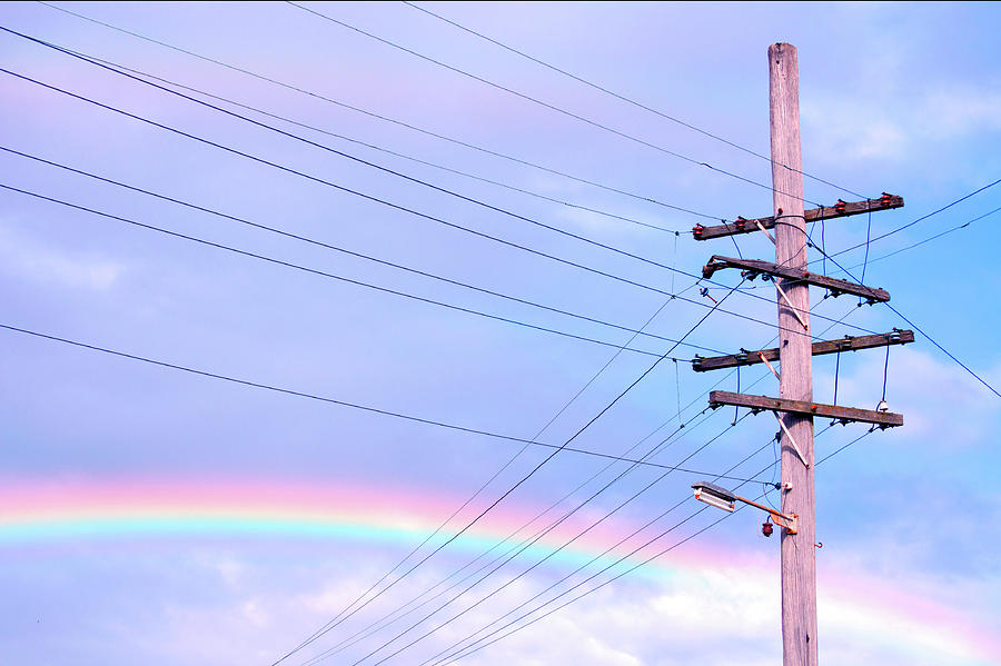 Powerlines Against Rainbow Sky Photograph by Nikki Yetman