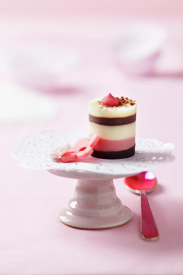 Pralines And A Lace Doily On A Mini Cake Stand Photograph by Franziska Taube