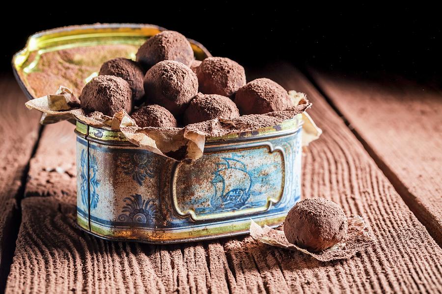 Pralines In An Old Metal Tin Photograph by Shaiith