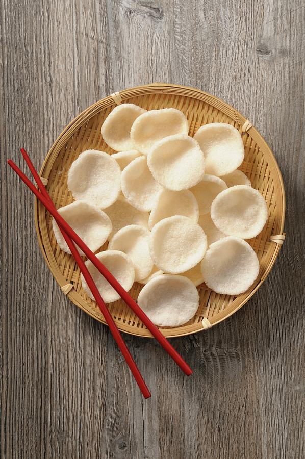 Prawn Crackers In A Bamboo Basket Photograph by Jean-christophe Riou