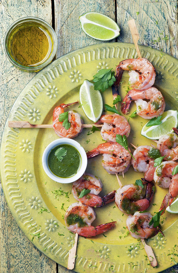 Prawn Skewers With Parsley Pesto And Limes Photograph by Spyros Bourboulis