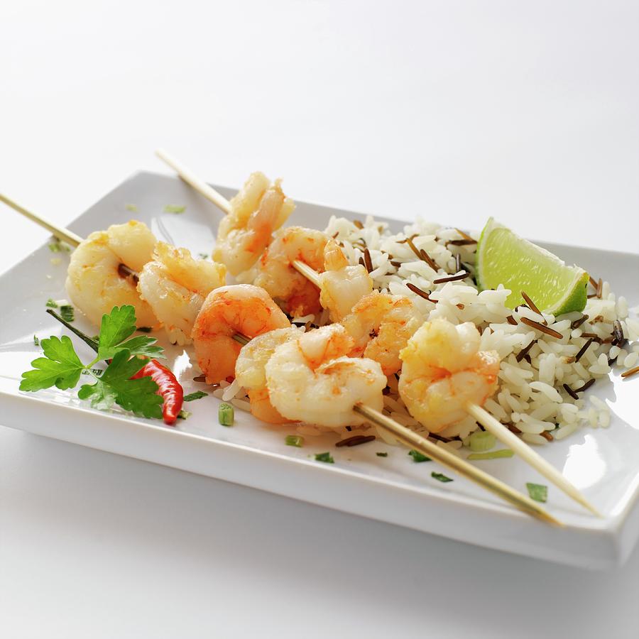 Prawn Skewers With Wild Rice And Limes Photograph by Robert Morris
