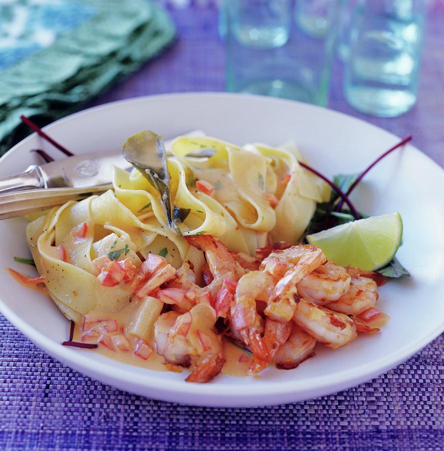 Prawns With Tomato Cream And Pasta Ribbons Photograph by Tine Guth Linse