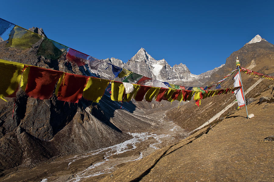 Prayer Flags On Dusty Mountainside Photograph by Cultura Exclusive/ben Pipe Photography