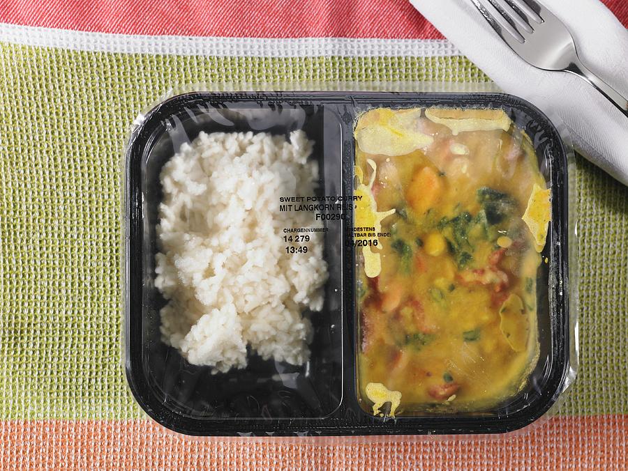 Pre-cooked And Frozen Chicken Curry As A Ready Meal In A Segregated Plastic Package Photograph by Foto4food