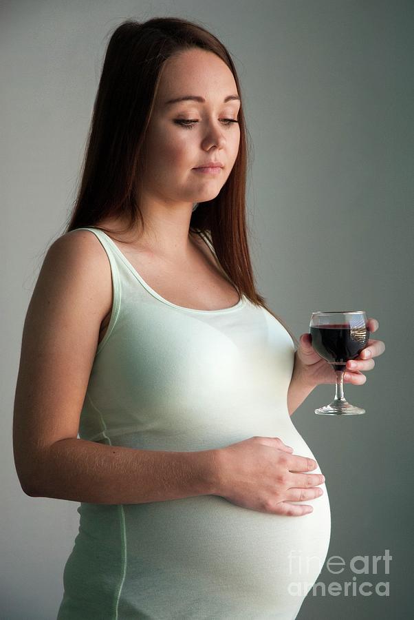 Pregnant Teenager Drinking Wine Photograph by Suzanne Grala/science