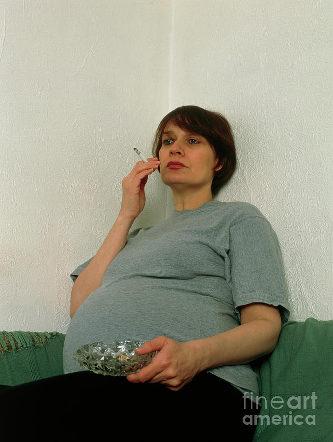 Pregnant Woman Smoking A Cigarette Indoors Photograph By Faye Norman Science Photo Library