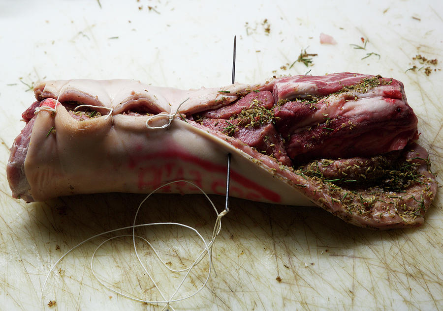 Preparing Rolled And Stuffed Pork Photograph by Hugh Johnson