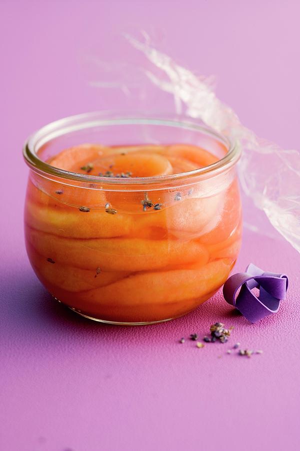 Preserved Melon With Lavender Flowers Photograph by Michael Wissing