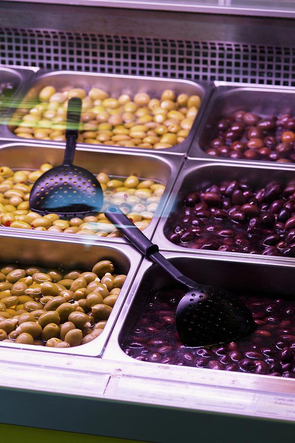 Preserved Olives On Display In The Counter At A Delicatessen Photograph by Alena Hrbkov