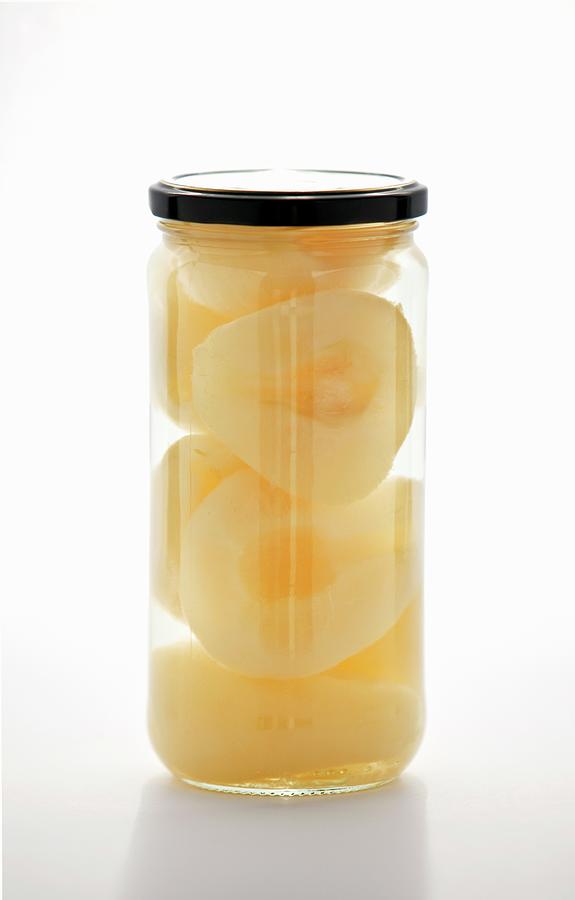 Preserved Pear Halves In A Jar Photograph by William Boch
