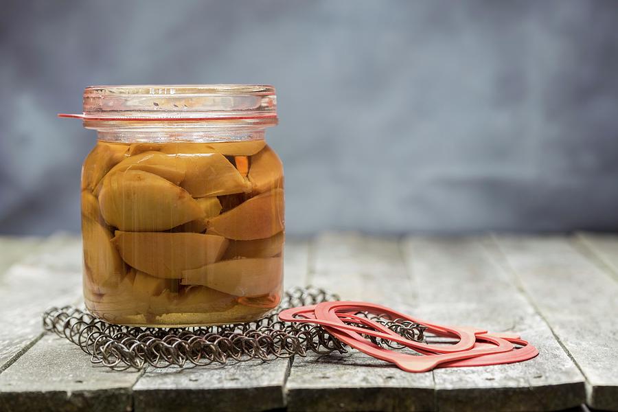 Preserved Pears In A Glass Jar Photograph by Nils Melzer