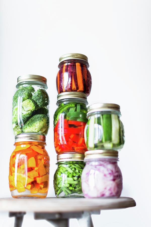 Preserving Jars Of Freshly Pickled Vegetables Stacked On An Old Stool Photograph by Sabine Lscher