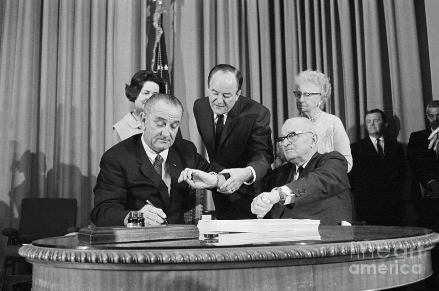 President Johnson Signing Medicare Bill Photograph by Bettmann