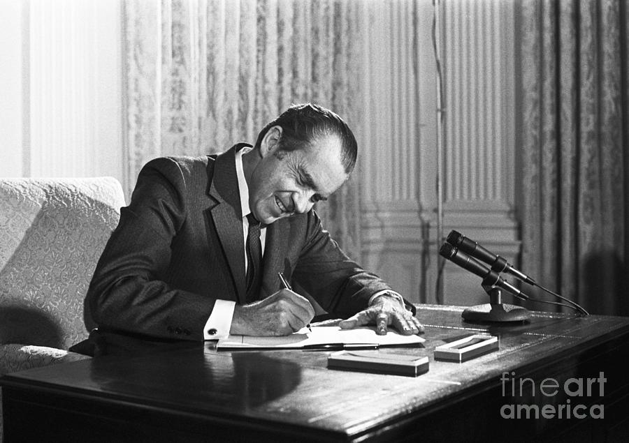 President Richard Nixon Signs Photograph by Bettmann