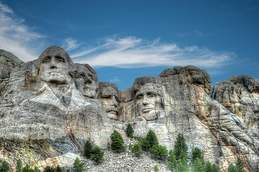 Presidential portraits carved into granite at Mount Rushmore National Memorial in the Black Hills  Photograph by Dan Friend