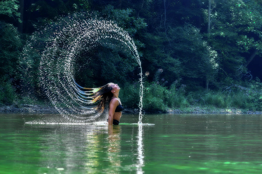 Pretty girl flipping water with her hair Photograph by Dan Friend
