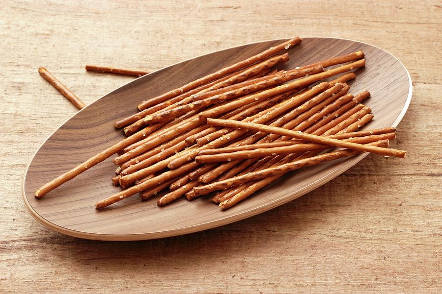 Pretzel Sticks In A Wooden Dish Photograph by Petr Gross