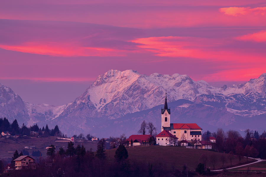 Prezganje church with snowy Kamnik Alps at sunset Photograph by Ian Middleton