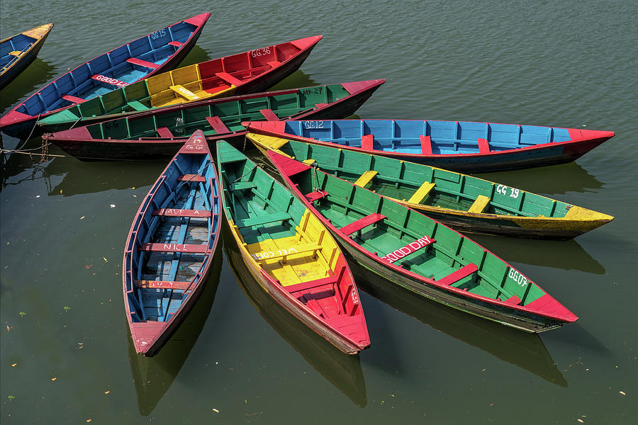 Primary colors abound as rowboats nestle on the lake Photograph by Leslie Struxness