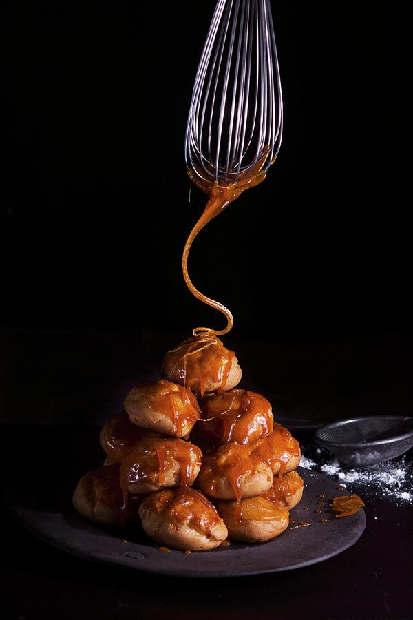 Profiteroles Being Caramelised Photograph by Kristy Snell