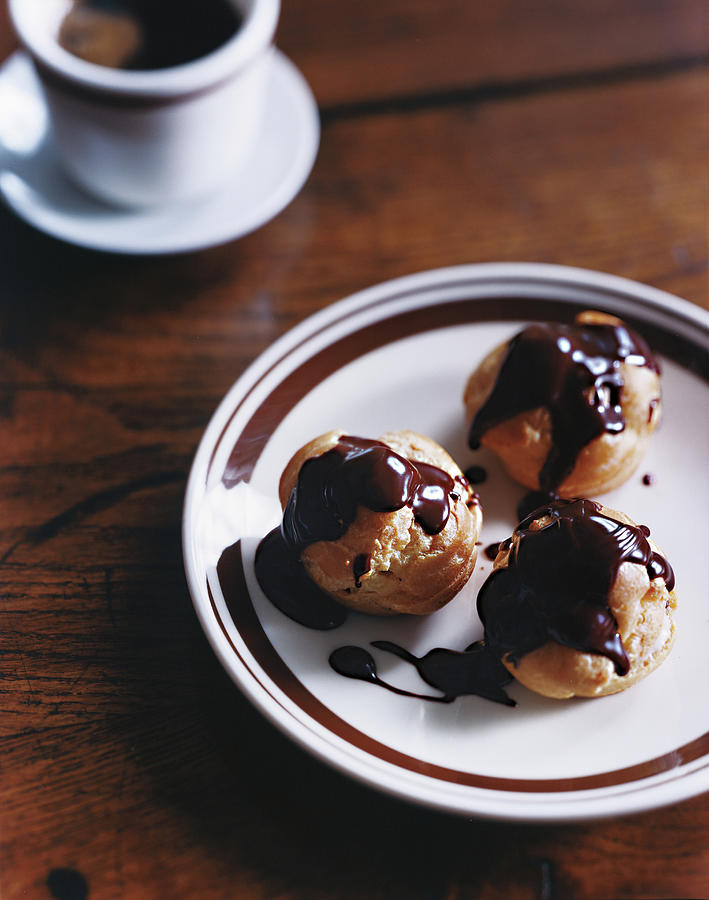 Profiteroles With Chocolate Sauce Photograph by Romulo Yanes