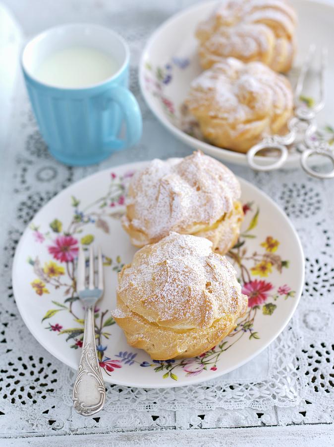 Profiteroles With Whipped Cream And Icing Sugar Photograph by Rua Castilho