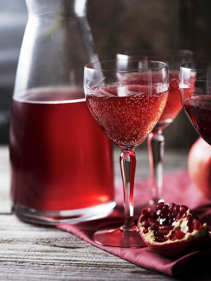 Prosecco And Pomegranate Drinks Photograph by Hannah Kompanik