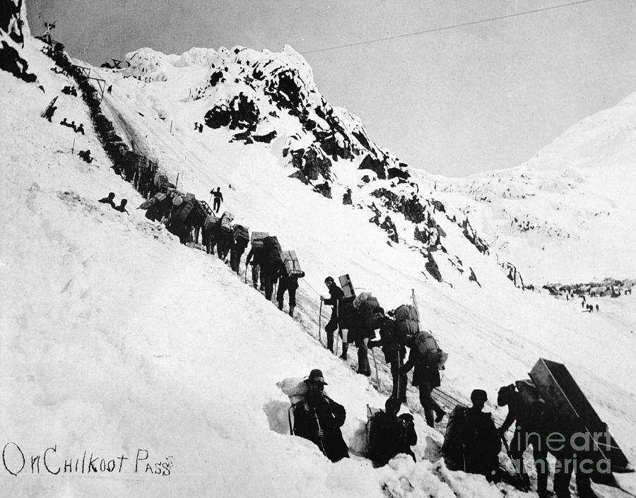 Prospectors Climbing The Chilkoot Pass During The Klondike Gold Rush Photograph by American Photographer