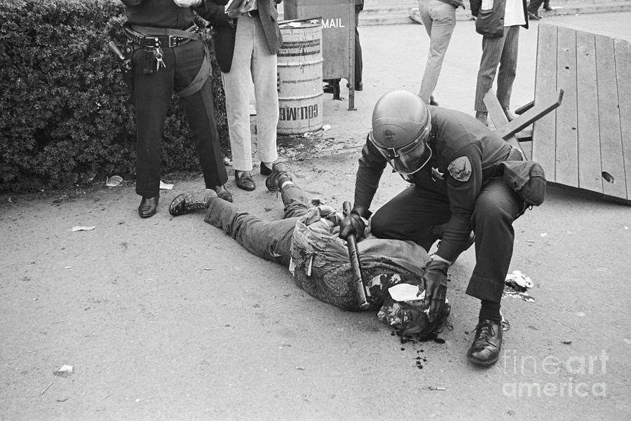 Protester Lying Injured On Sidewald Photograph by Bettmann Protester Lying Injured On Sidewald Photograph by Bettmann
