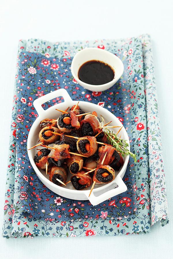 Prunes With Almonds Wrapped In Bacon Photograph by Rua Castilho