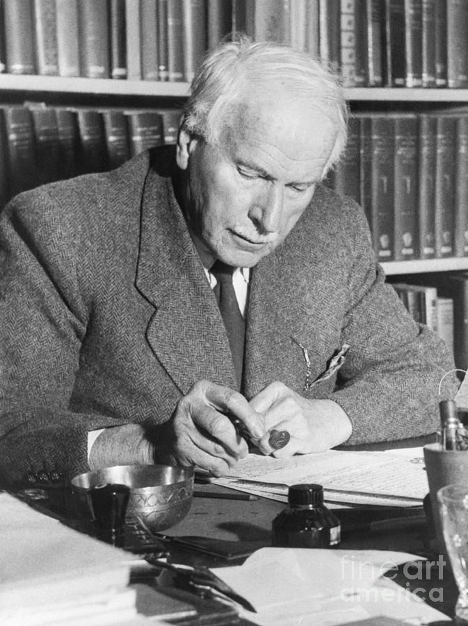 Psychiatrist Carl Jung At Desk Writing Photograph by Bettmann