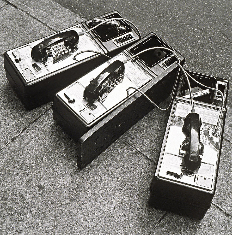 Public Phones Lying On Sidewalk Photograph by Henri Silberman